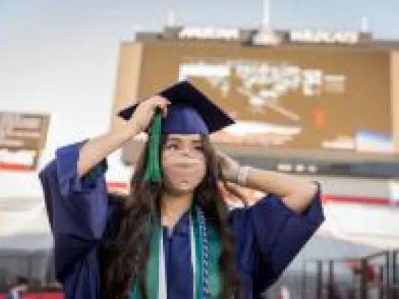women in graduation cap and gown