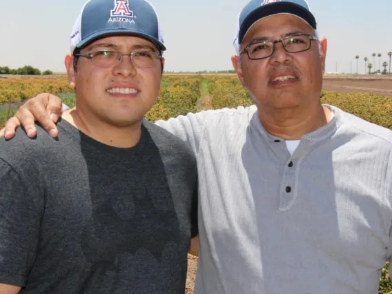 juan and marco in front of safflower field